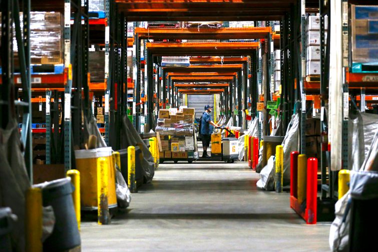 Associates fill orders for both Ralphs and Food 4 Less grocery stores at the Ralphs Distribution Center in Riverside, Calif. The 80 acre, 1.2-million-square-foot distribution center employs 1100 workers.