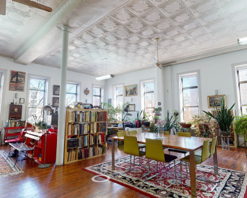 The property at 216 Grand Street is currently utilized as an art gallery within a 11,000-square-foot building. 