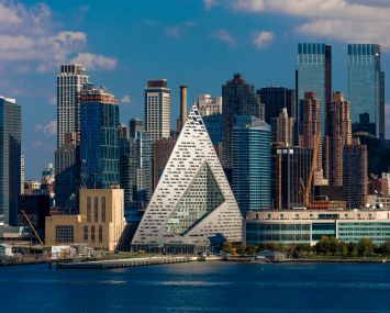 Midtown Skyline of Manhattan, New York shows VIA 57 West at 625 West 57th St. in Hells Kitchen Pyramid and Hudson River, architecture by Bjarke Ingelss Tetrahedron.
