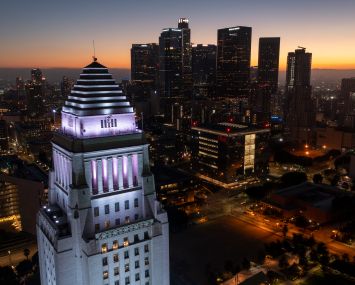 In an aerial view, the top of Los Angeles City Hall is seen.