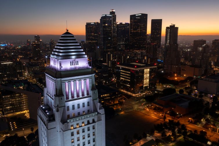 In an aerial view, the top of Los Angeles City Hall is seen.