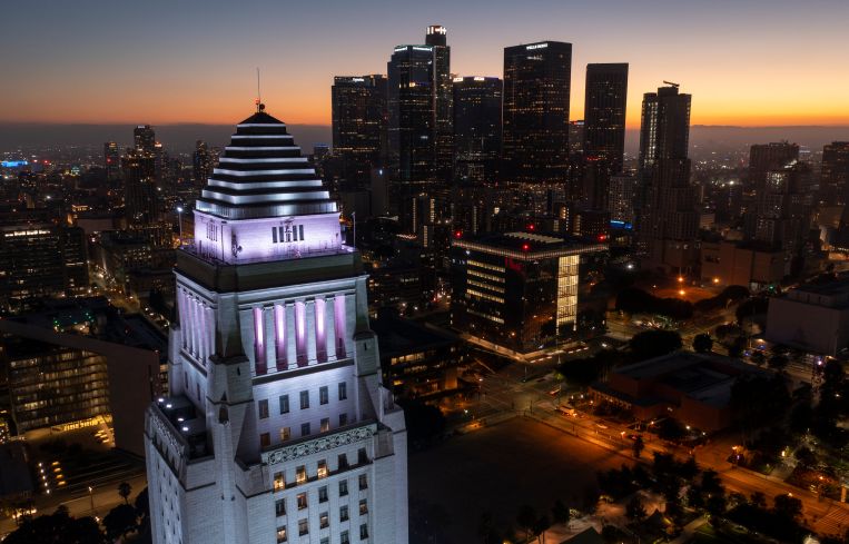 In an aerial view, the top of Los Angeles City Hall is seen.