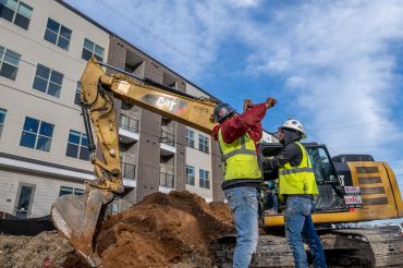 Construction work on a new apartment building continues on February 28, 2023. Multifamily  properties accounted for most of the loan collateral composition by property type in CRED iQ's interest rate cap analysis. 