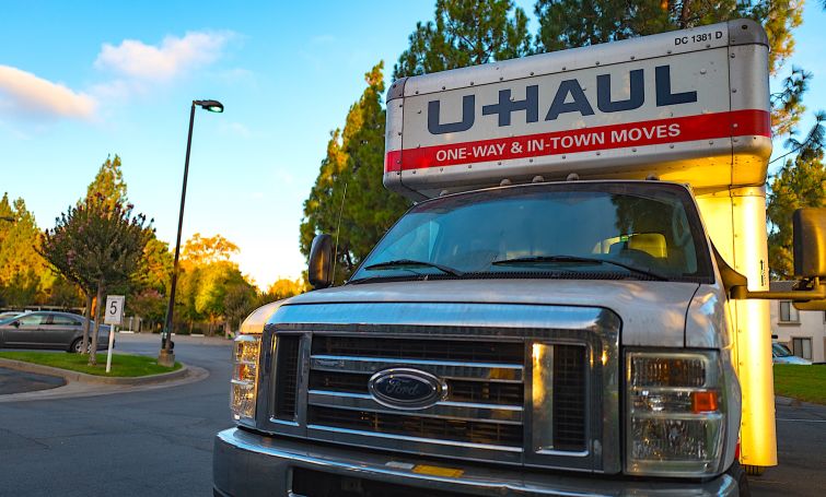 U-Haul moving truck in the parking lot of an apartment complex in the San Francisco Bay Area.