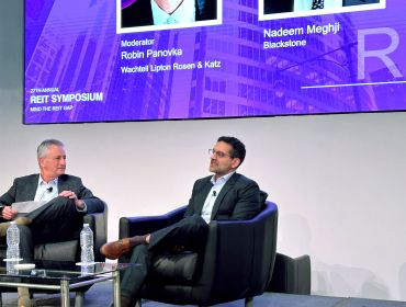 NADEEM MEGHJI (RIGHT), HEAD OF BLACKSTONE REAL ESTATE – AMERICAS, SPEAKS AT THE 27TH ANNUAL REIT SYMPOSIUM HOSTED BY NYU'S SCHACK INSTITUTE OF REAL ESTATE IN A DISCUSSION MODERATED BY ROBIN PANOVKA, PARTNER AT WACHTELL LIPTON ROSEN & KATZ.