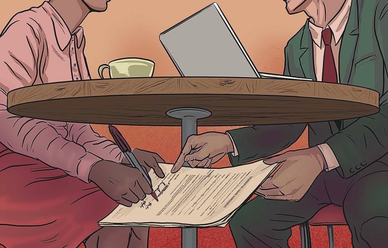 A deal is signed under a coffee table.