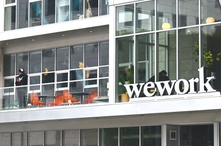 The WeWork logo outside of an office space rental location in Santa Monica, Calif., on March 20.
