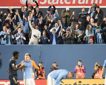 New York City FC fans celebrate after a win at Yankee Stadium.