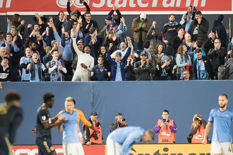 New York City FC fans celebrate after a win at Yankee Stadium.