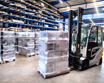 Forklift truck stands in a warehouse.
