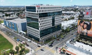 Writers and their supporters walk the picket line outside the Netflix offices and studios — owned by Hudson Pacific Properties — in Hollywood. More than 11,000 television and movie writers are on strike for the first time since 2007 after talks with studios and streamers failed to clinch a deal.
