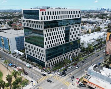 Writers and their supporters walk the picket line outside the Netflix offices and studios — owned by Hudson Pacific Properties — in Hollywood. More than 11,000 television and movie writers are on strike for the first time since 2007 after talks with studios and streamers failed to clinch a deal.