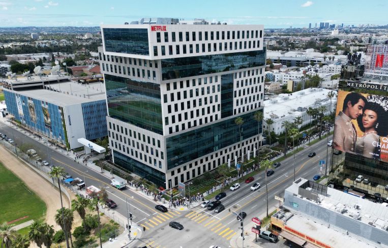 Writers and their supporters walk the picket line outside the Netflix offices and studios — owned by Hudson Pacific Properties — in Hollywood. More than 11,000 television and movie writers are on strike for the first time since 2007 after talks with studios and streamers failed to clinch a deal.