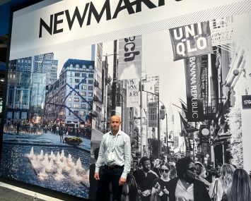 Ariel Schuster, vice chairman at Newmark, outside the brokerage firm's booth at the ICSC conference inside the Las Vegas Convention Center.