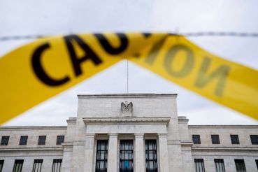 The US Federal Reserve building is seen past caution tape in Washington, DC, on September 19, 2022. 