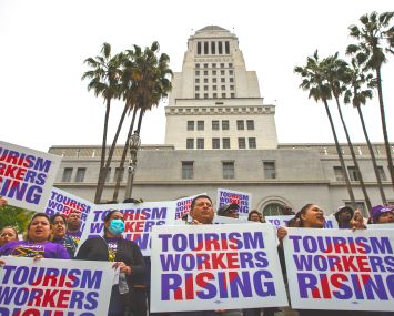 Unions at press conference held by Los Angeles City Councilman Curren Price to announce a motion that would raise the wages for tourism workers to $25 an hour, on the steps of City Hall in April 2023.