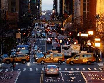 NEW YORK, NY - DECEMBER 8: Taxi cabs cross 42nd Steet as the sun rises on December 8, 2022, in New York City.  (Photo by Gary Hershorn/Getty Images)