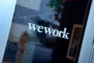 MIAMI, FLORIDA - DECEMBER 13:  An entranceway door to a WeWork office building on December 13, 2022 in Miami, Florida. WeWork Inc. is reported to be close to default as it runs low on cash reserves. 