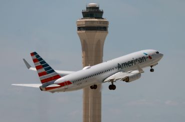 An American Airlines plane takes off from the Miami International Airport.