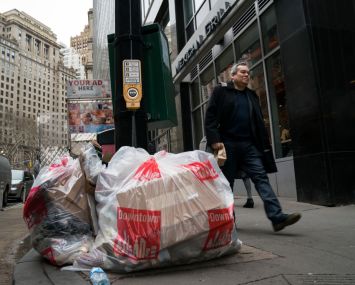 New York City's sanitation department wants to get trash bags off the sidewalks and into containers. But it may not be able to implement the containers in Lower Manhattan and Midtown.
