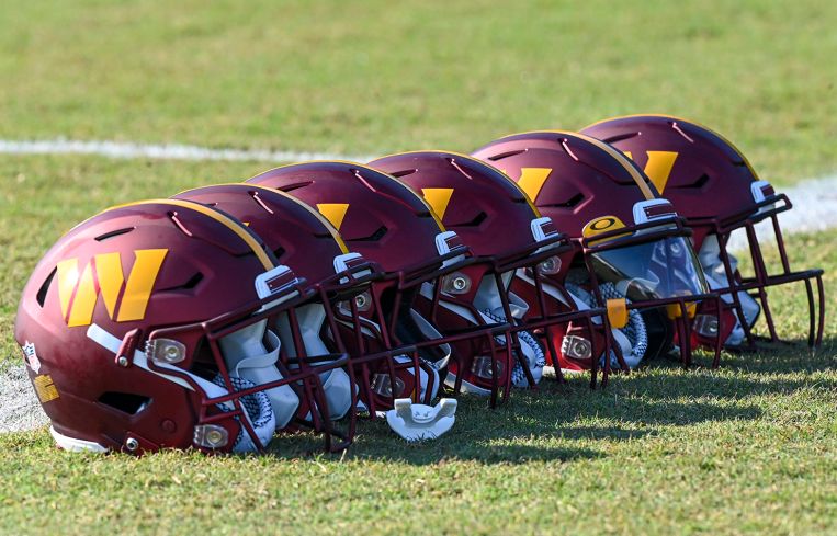 Washington Commanders helmets on the field