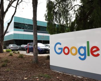 A sign is posted in front of a Google office in February 2023 in Mountain View, Calif.