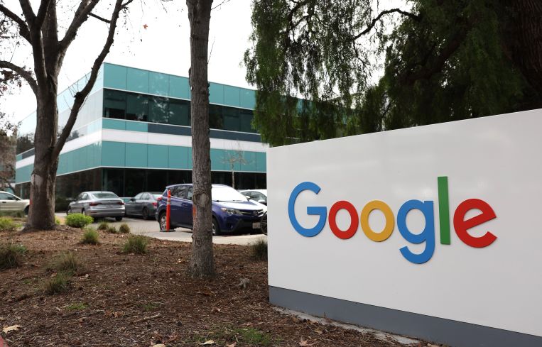 A sign is posted in front of a Google office in February 2023 in Mountain View, Calif.