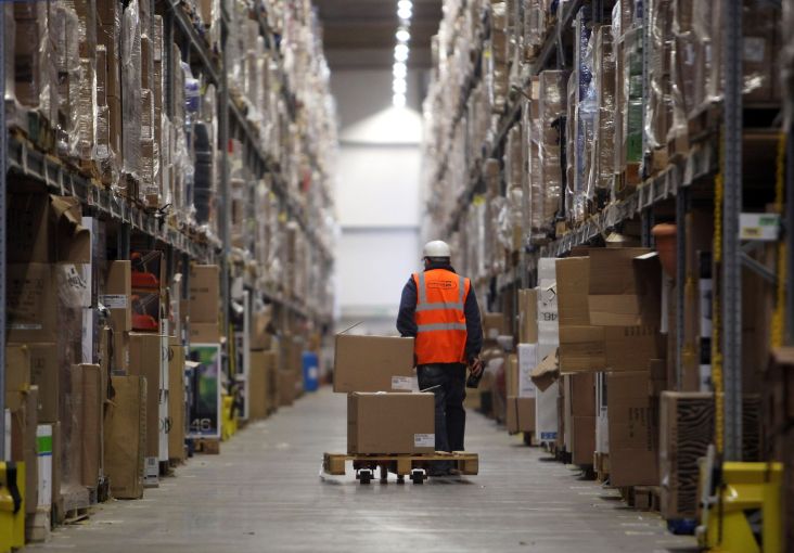 Staff at a fulfillment center process orders.