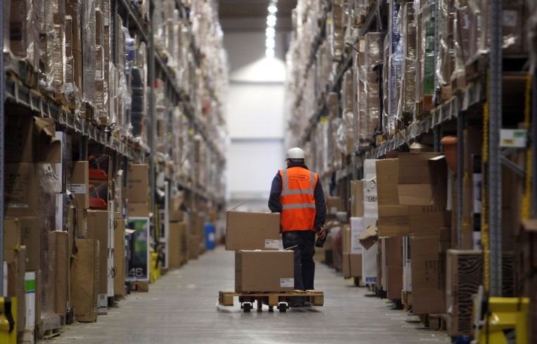 Staff at a fulfillment center process orders.