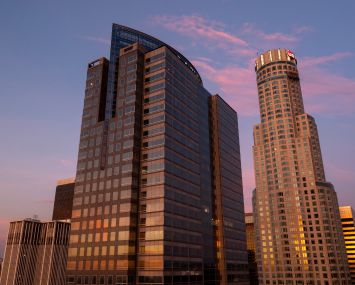 In an aerial view, the Gas Co. Tower, left, and U.S. Bank buildings are illuminated by the rising sun in Los Angeles, California.