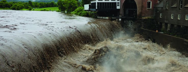 Rushing water overtaking property.
