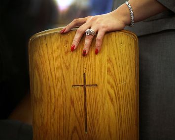 A woman's hand in a church in Brooklyn