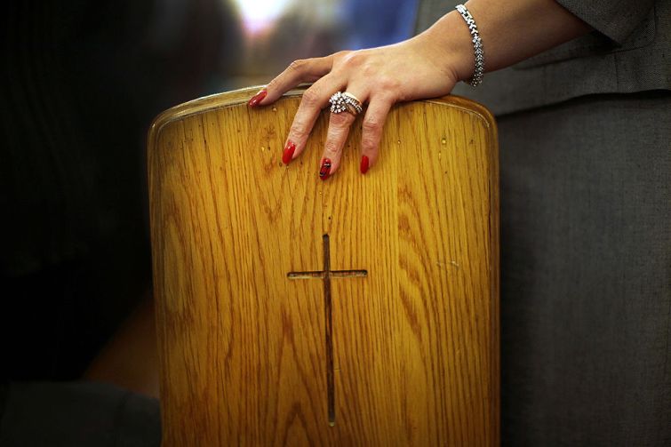 A woman's hand in a church in Brooklyn