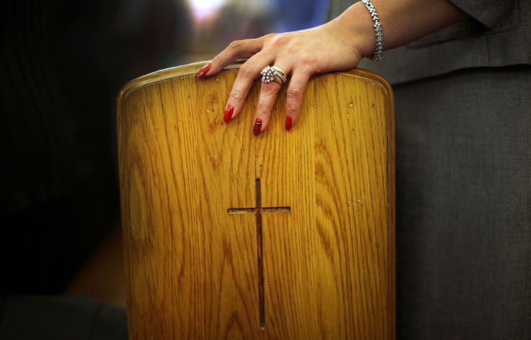 A woman's hand in a church in Brooklyn