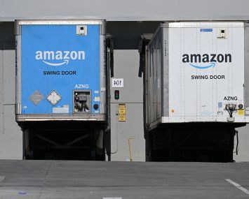 Freight semi trailers are docked at the Amazon warehouse in in July, 2023.