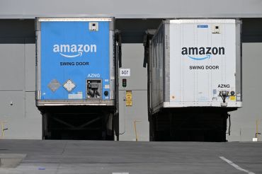 Freight semi trailers are docked at the Amazon warehouse in in July, 2023.
