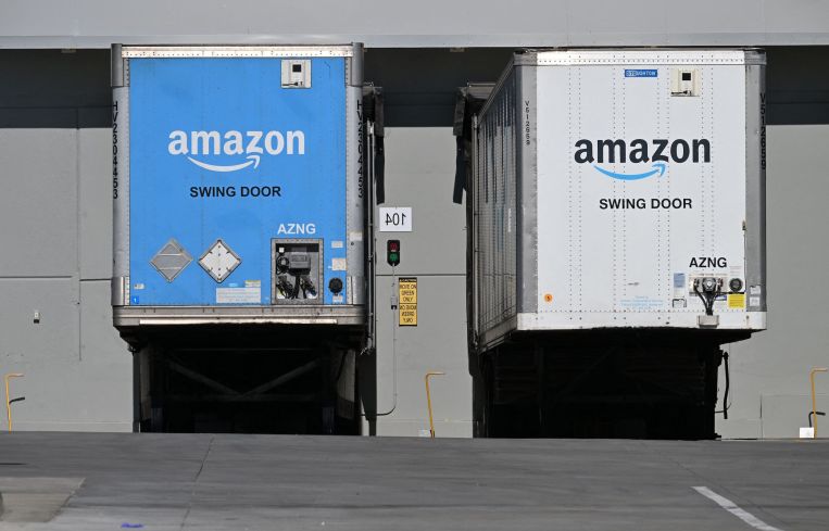 Freight semi trailers are docked at the Amazon warehouse in in July, 2023.