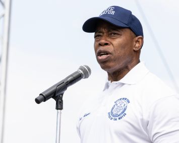 NEW YORK, NEW YORK - AUGUST 12: Mayor Eric Adams speaks during Hong Kong Dragon Boat Festival opening ceremony at Flushing Meadows Park on August 12, 2023 in New York. (Photo by Lev Radin/VIEWpress)