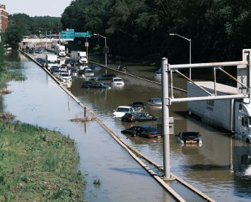 Cars sit abandoned on the flooded Major Deegan Expressway in the Bronx