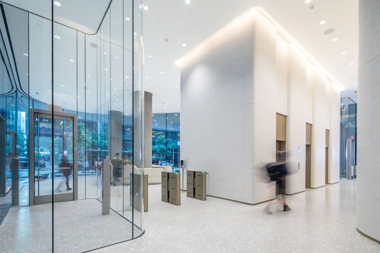 White walls and white terrazzo floors, along with new LED lighting in the ceiling, have helped brighten the lobby too.