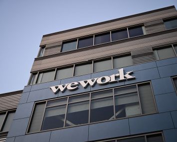 The WeWork logo is displayed outside of a shared commercial office space building in Los Angeles