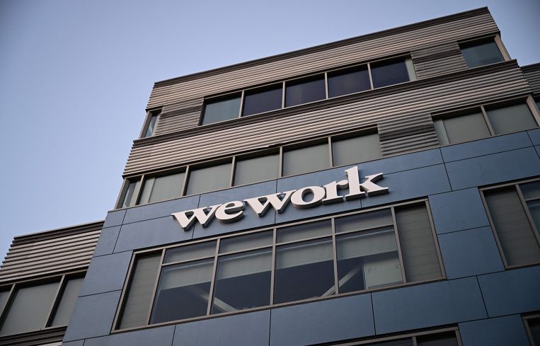 The WeWork logo is displayed outside of a shared commercial office space building in Los Angeles