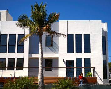 A construction crew works to complete a nearly finished project in Los Angeles.