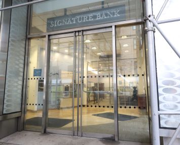 A lobby entrance that says "Signature Bank" above it.