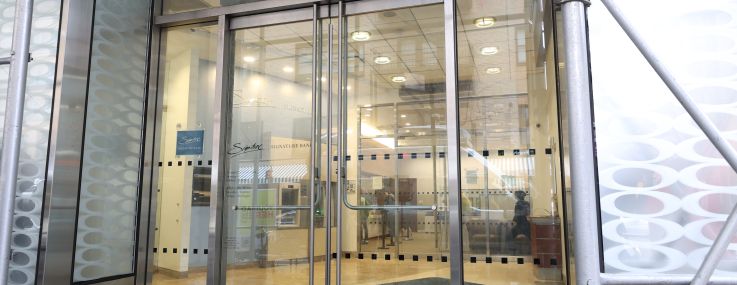 A lobby entrance that says "Signature Bank" above it.