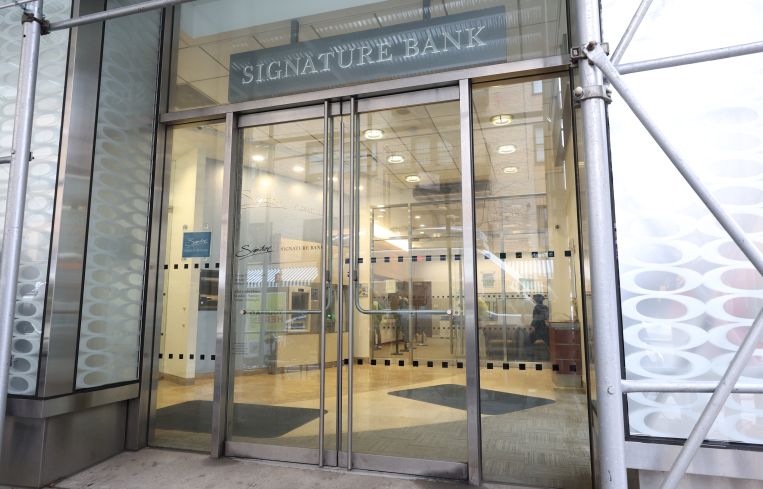 A lobby entrance that says "Signature Bank" above it.