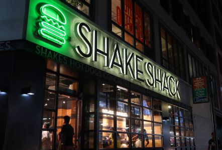 People walk into a Shake Shack restaurant in Herald Square on August 19, 2023, in New York City.