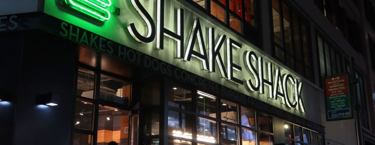 People walk into a Shake Shack restaurant in Herald Square on August 19, 2023, in New York City.