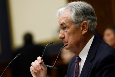 Federal Reserve Chair Jerome Powell removes his glasses as he testifies before the House Committee on Financial Services on Capitol Hill on March 08, 2023. 
