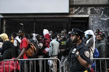 Migrants outside of the Roosevelt Hotel in Manhattan in August. 